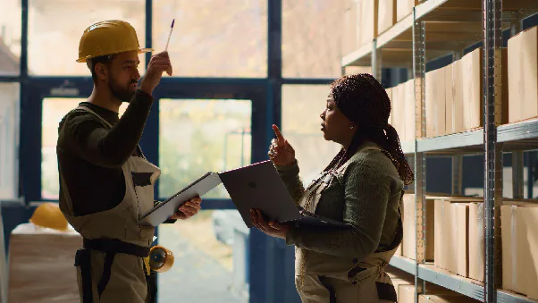 A sourcing agent speaking to a company representative.